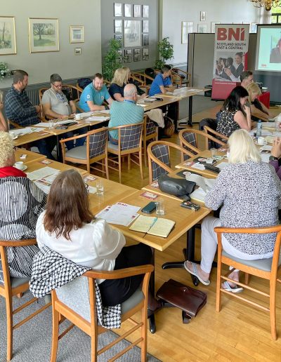 Informal group meeting with business professionals at a BNI gathering.